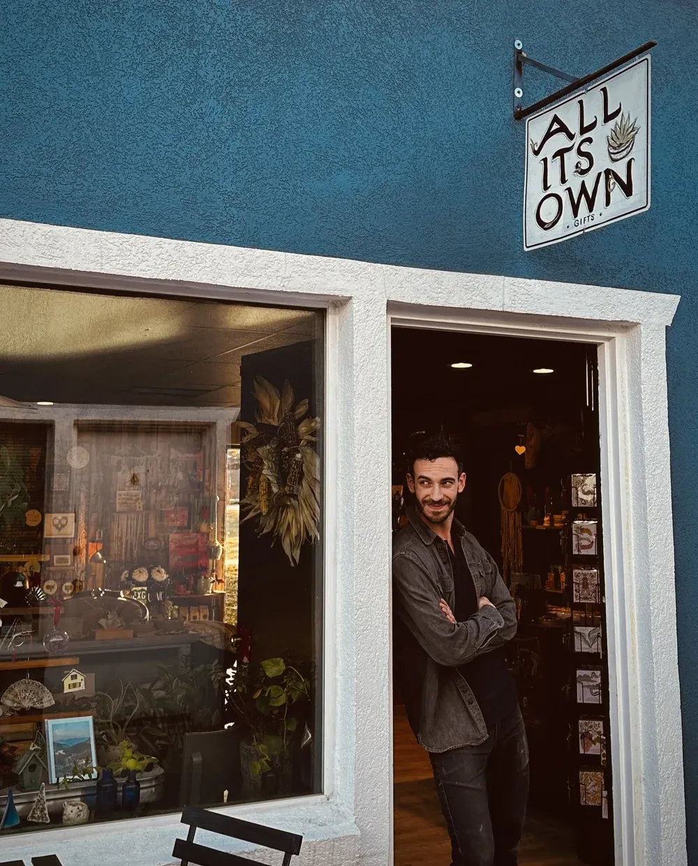 The All Its Own gift shop entrance inside Mint and Serif, with its hand-painted sign